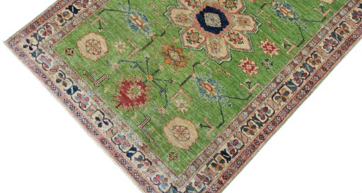 Backside of handmade New Kazak rug showing knot structure and weave density