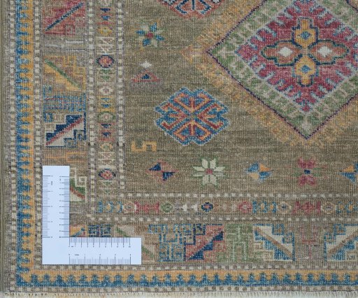 Corner detail of New Kazak rug showing border pattern and Wool pile