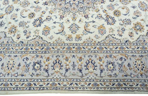 Corner detail of New Kashan rug showing border pattern and Wool pile