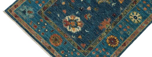 Backside of handmade New Farahan rug showing knot structure and weave density