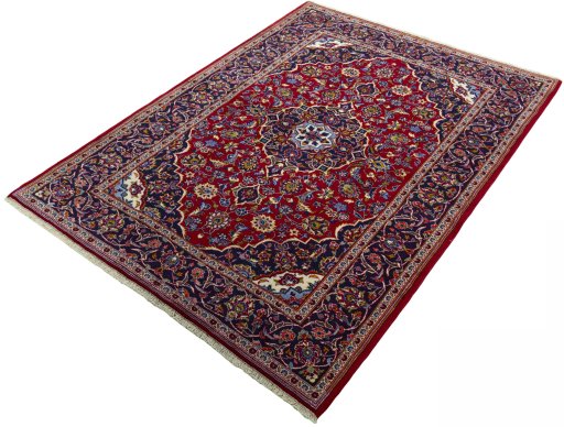 Corner detail of 2000s Kashan rug showing border pattern and Wool pile
