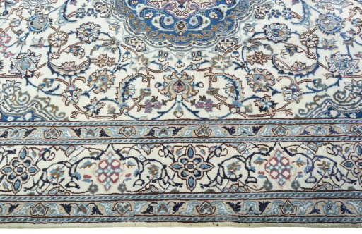 Corner detail of 2000s Nain rug showing border pattern and Wool pile