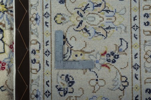 Backside of handmade 2000s Kashan rug showing knot structure and weave density