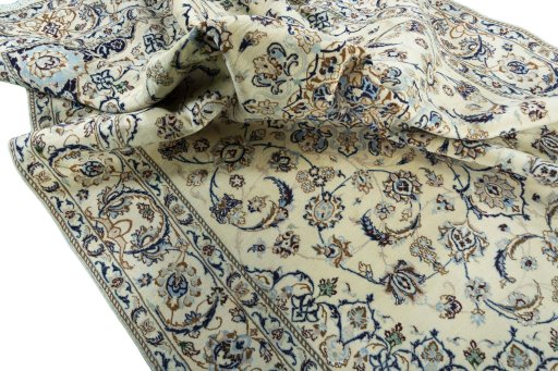 Surface texture of 2000s Nain rug with natural Wool and intricate pattern