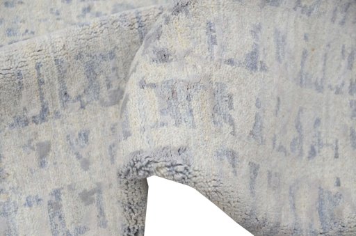 Backside of handmade New Mahli rug showing knot structure and weave density