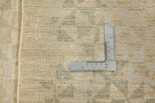Backside of handmade New Mahli rug showing knot structure and weave density
