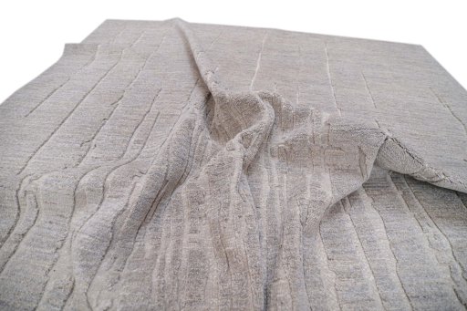 Backside of handmade New Mahli rug showing knot structure and weave density