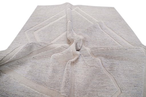 Backside of handmade New Mahli rug showing knot structure and weave density