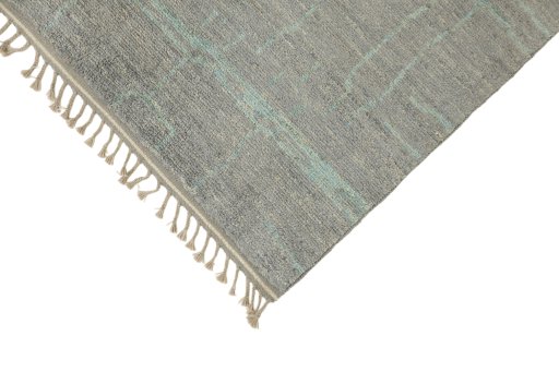 Backside of handmade New Morocco rug showing knot structure and weave density