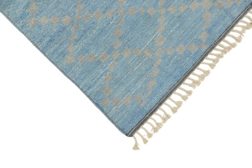 Backside of handmade New Morocco rug showing knot structure and weave density