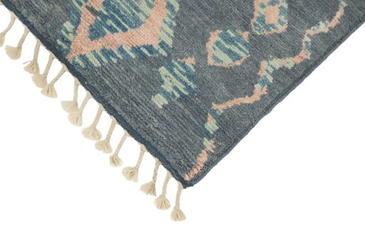 Backside of handmade New Morocco rug showing knot structure and weave density