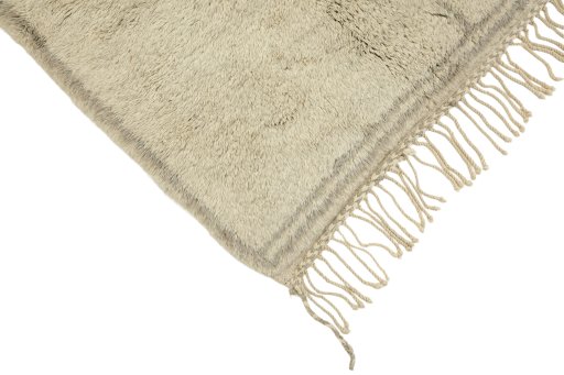 Backside of handmade New Morocco rug showing knot structure and weave density