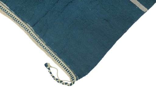Backside of handmade New Morocco rug showing knot structure and weave density