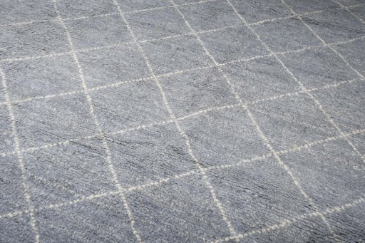Backside of handmade New Morocco rug showing knot structure and weave density