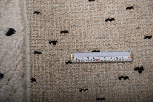 Backside of handmade New Morocco rug showing knot structure and weave density