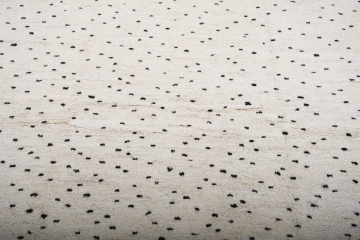 Backside of handmade New Morocco rug showing knot structure and weave density