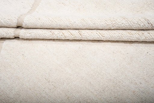 Backside of handmade New Morocco rug showing knot structure and weave density
