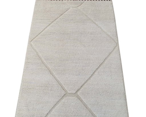 Backside of handmade New Morocco rug showing knot structure and weave density