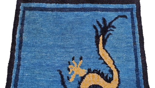 Backside of handmade New Morocco rug showing knot structure and weave density