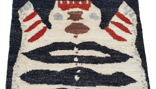 Backside of handmade New Morocco rug showing knot structure and weave density