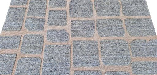 Backside of handmade New Morocco rug showing knot structure and weave density