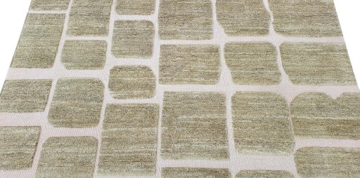 Backside of handmade New Morocco rug showing knot structure and weave density