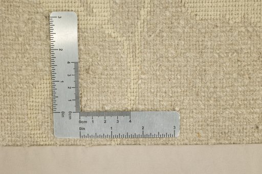 Corner detail of New Nepal Carpets rug showing border pattern and Wool pile