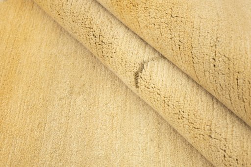 Full view of New Nepal Carpets rug from Nepal, 244 × 173 cm in Cream tones