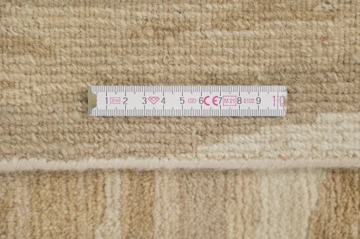 Full view of New Nepal Carpets rug from Nepal, 274 × 183 cm in Cream tones