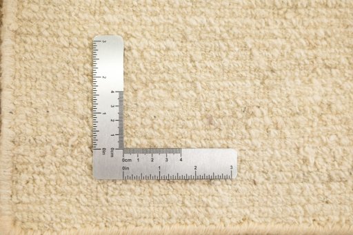 Full view of 2000s Nepal Carpets rug from Nepal, 239 × 170 cm in Cream tones