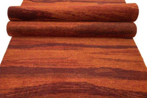 Full view of New Nepal Carpets rug from Nepal, 300 × 86 cm in Red tones