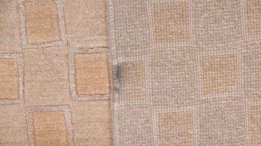 Corner detail of New Nepal Carpets rug showing border pattern and Wool pile