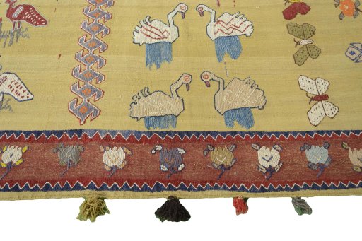Close-up detail of 1970s Kilim Dastan rug from Iran / Persia showing Wool weave