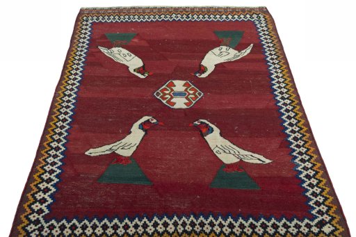 Close-up detail of 2000s Kilim Dastan rug from Iran / Persia showing Wool weave