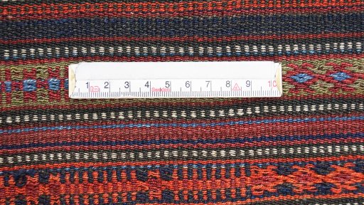 Close-up detail of 1920s Kilim Jajim rug from Iran / Persia showing Wool weave