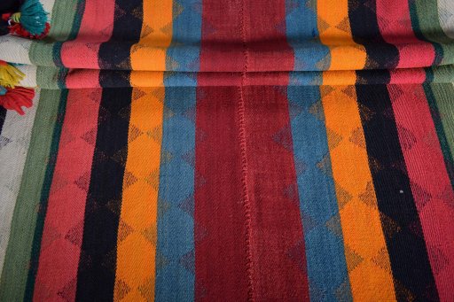 Full view of 2000s Kilim Jajim rug from Iran / Persia, 325 × 132 cm in Red tones