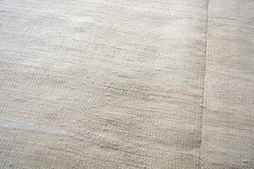 Backside of handmade New Kilim Kiasar rug showing knot structure and weave density