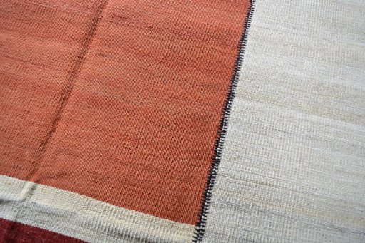 Backside of handmade New Kilim Kiasar rug showing knot structure and weave density