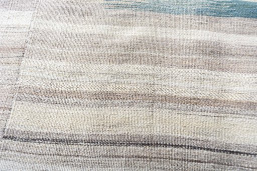 Backside of handmade New Kilim Kiasar rug showing knot structure and weave density