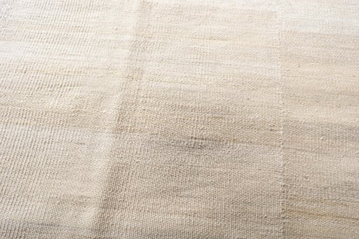 Backside of handmade New Kilim Kiasar rug showing knot structure and weave density