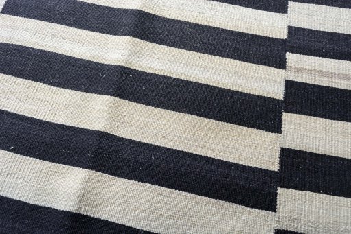 Backside of handmade New Kilim Kiasar rug showing knot structure and weave density