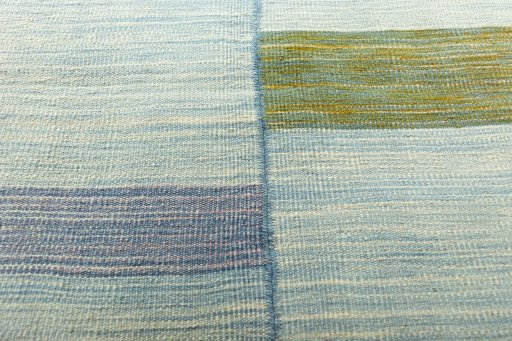 Backside of handmade New Kilim Kiasar rug showing knot structure and weave density
