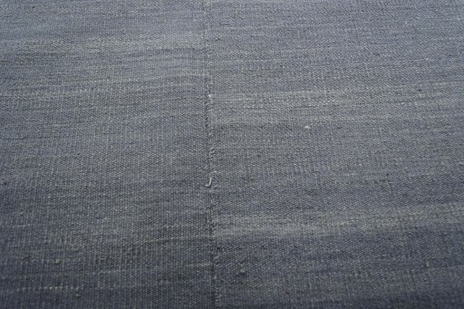 Backside of handmade New Kilim Kiasar rug showing knot structure and weave density