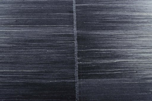 Backside of handmade New Kilim Kiasar rug showing knot structure and weave density