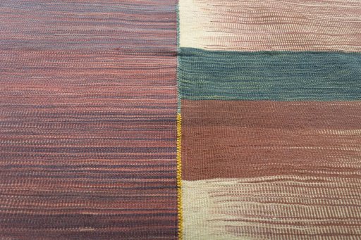 Backside of handmade New Kilim Kiasar rug showing knot structure and weave density