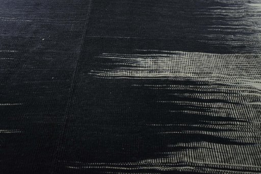 Backside of handmade New Kilim Kiasar rug showing knot structure and weave density