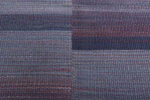 Backside of handmade New Kilim Kiasar rug showing knot structure and weave density