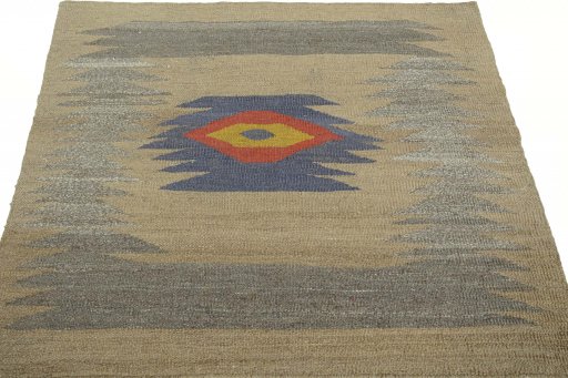 Close-up detail of New Kilim Sofre rug from Iran / Persia showing Wool weave