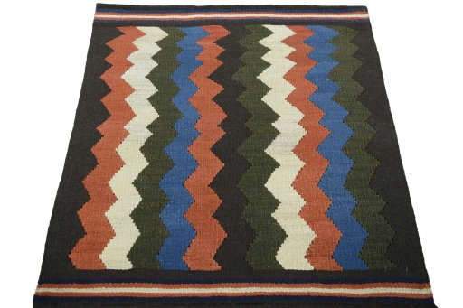Close-up detail of New Kilim Sofre rug from Iran / Persia showing Wool weave