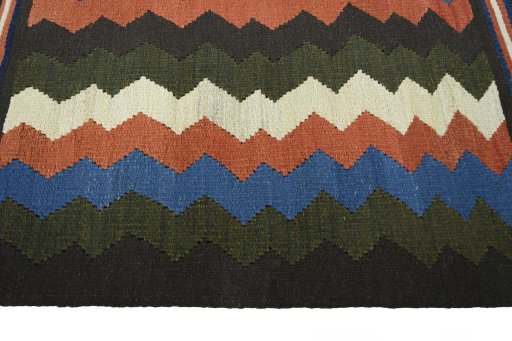 Close-up detail of New Kilim Sofre rug from Iran / Persia showing Wool weave